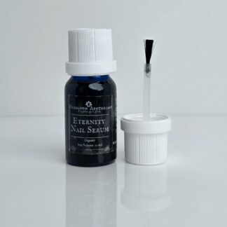 Blue glass bottle with white cap that has a brush on applicator